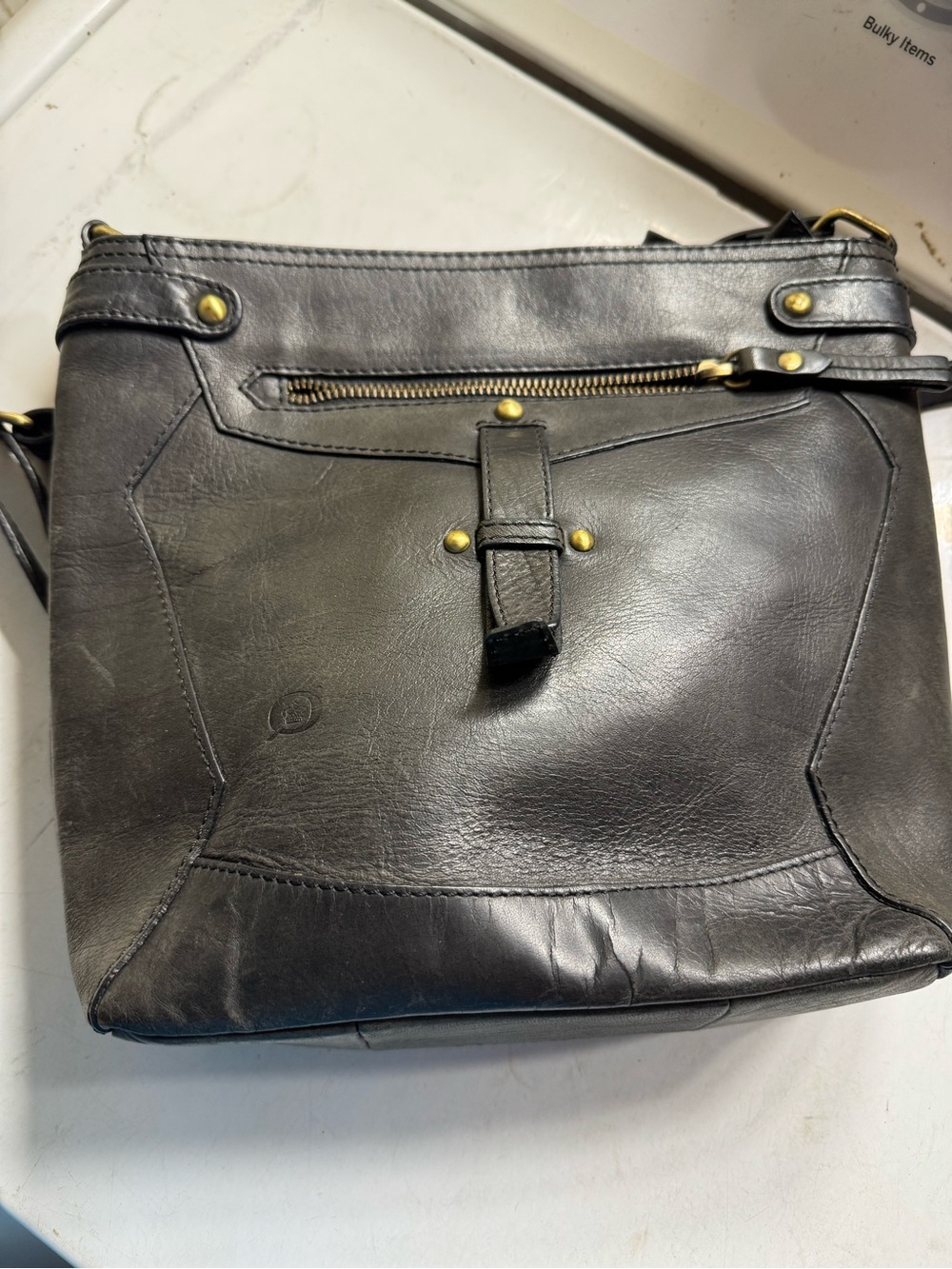 Born Black Leather Crossbody Bag with Brass Zipper